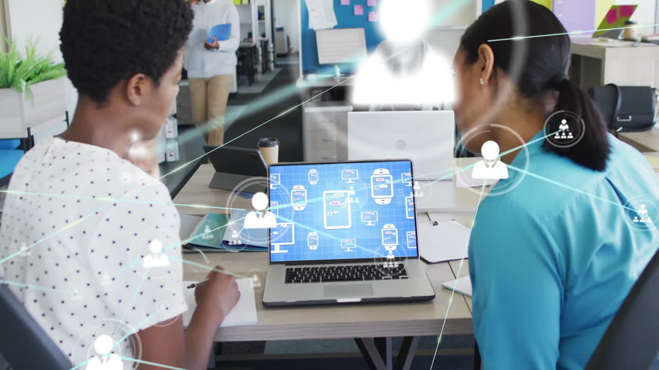 Collaborating in office, diverse colleagues sharing data and network connections