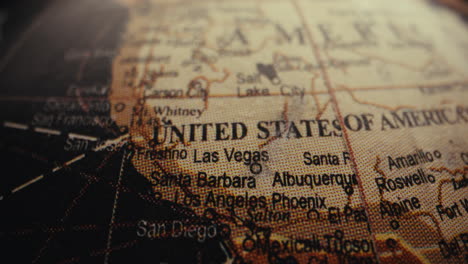 close-up of a vintage world globe, focusing on the united states