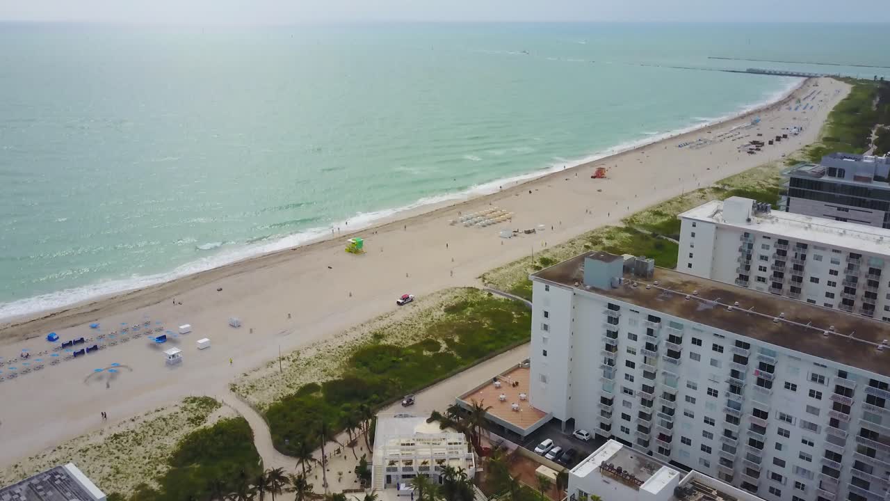 Tilt Up Aerial View of Miami South Beach, Florida USA, Condominium Buildings and Atlantic Ocean