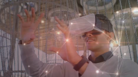 Animation-of-network-of-connections-over-businessman-using-vr-headset