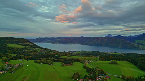 scenic attersee village in lush forested landscape next to lake, austria