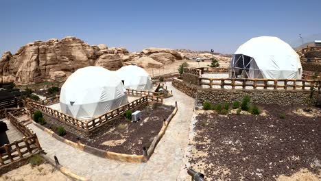 modern bedouin camp in desert landscape of jordan near petra tourist attraction on hot sunny day