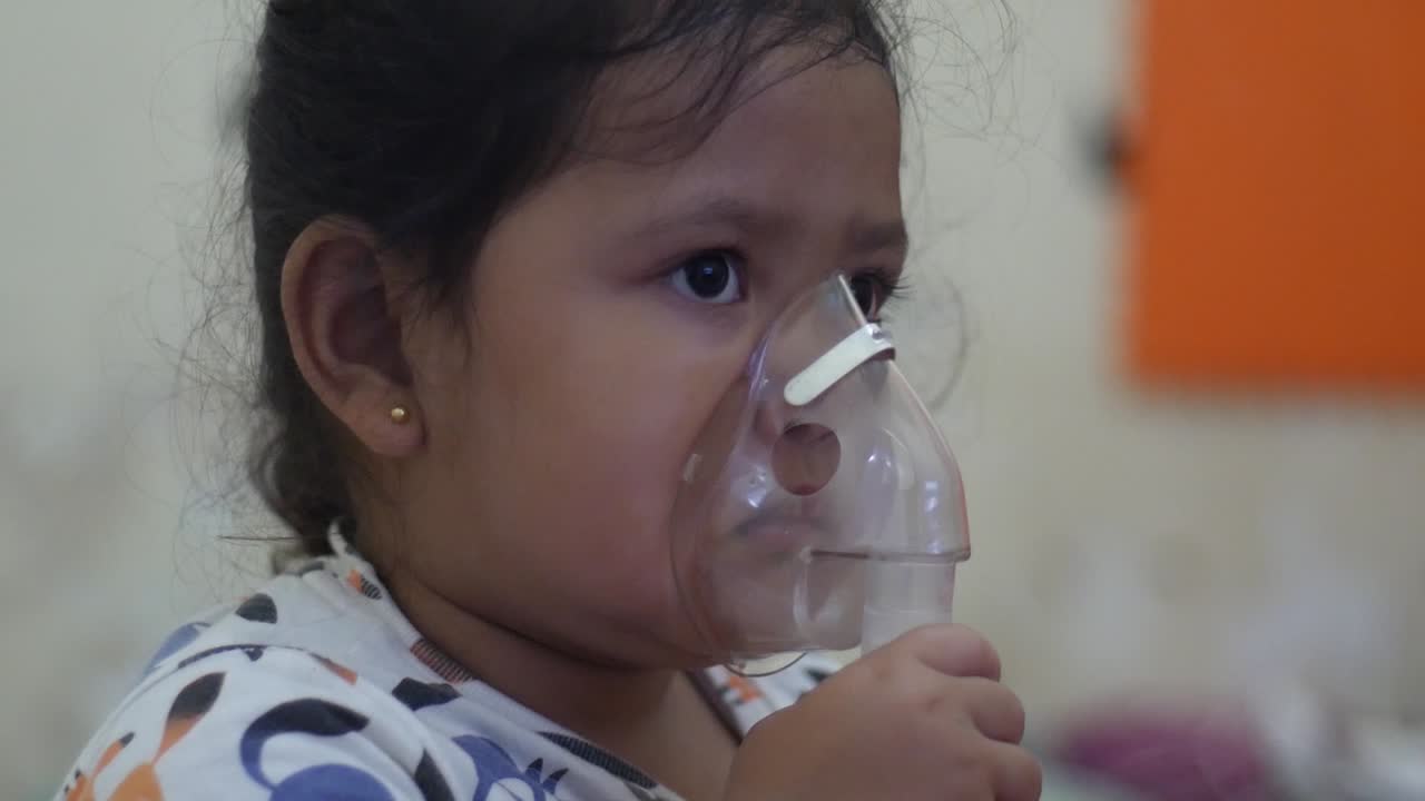 Close up asian little girl inhaler he use making inhalation nebulizer, health medical care