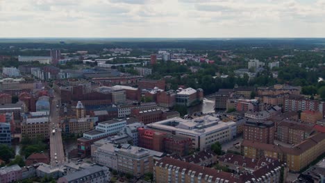 Downtown-and-street-traffic-in-Norrkoping-city-in-aerial-drone-view