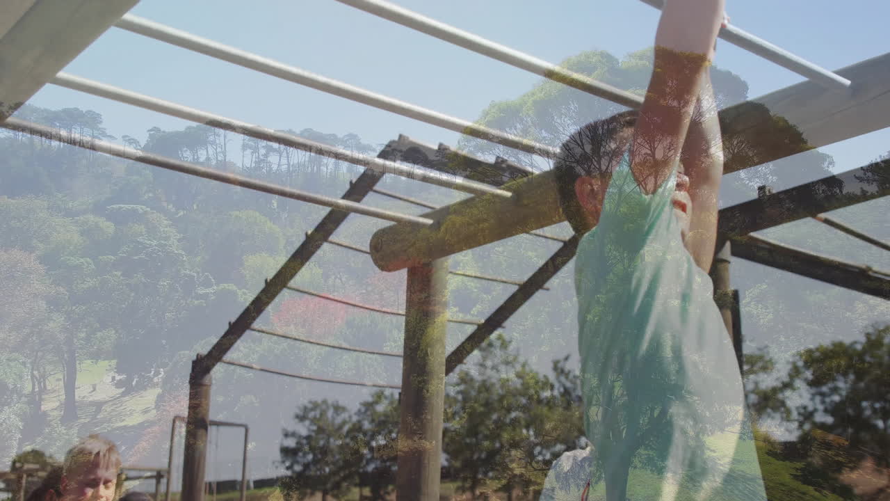 Playing on monkey bars, child with forest animation overlay in background