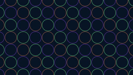 círculos coloridos en un patrón dinámico sobre un fondo oscuro