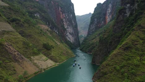 Formed-from-limestone,-slopes-covered-in-vegetation,-turquoise-river-water