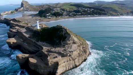 lighthouse landmark at castlepoint on north island of new zealand - aerial circling view