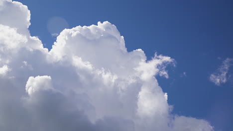 Clouds-rush-past-sky-as-weather-changes,-low-angle-time-lapse