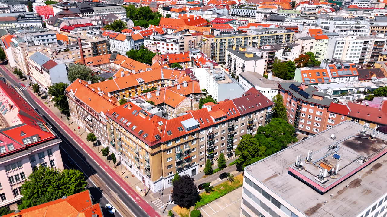 Footage over the beautiful historical buildings in the old town of Bratislava, Slovakia. Flight above the houses with inner courtyards and modern streets