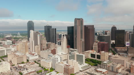 Aerial-view-tall-modern-office-buildings-downtown.-Zooming-out-footage-of-skyscrapers-group-from-drone.-Dallas,-Texas,-US