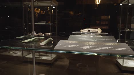 ancient weapons in glass-case at the exhibition in the museum of biskupin, poland