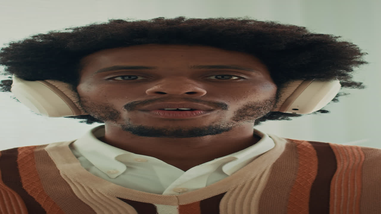 Vertical POV of Male Manager Explaining Project Tasks to Camera at Online Meeting