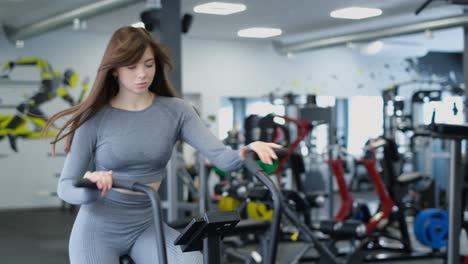 asian girl active sportswoman training on exercise bike in fitness club or gym asian girl active sportswoman training on exercise bike in fitness club or gym cardio training video
