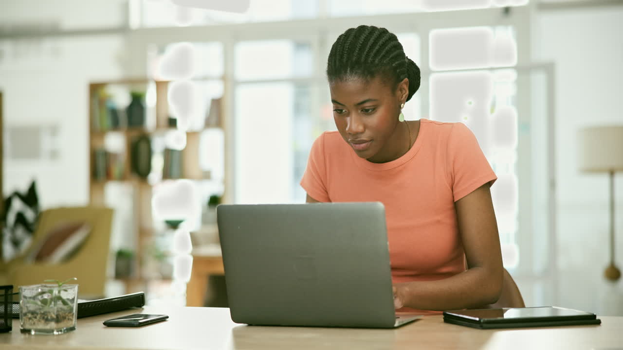 Woman Working on Laptop in Modern Office