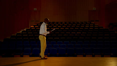 senior african american businessman practicing speech in empty auditorium 4k