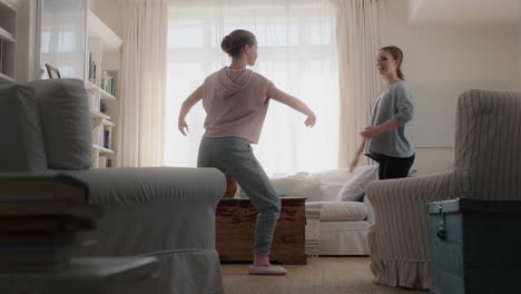 happy teenage girls practicing ballet dance moves at home best friends having fun rehearsal in living room