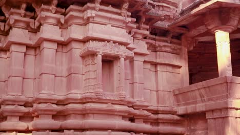 red stone ancient hindu temple architecture from unique angle at day