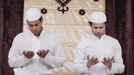 muslim people reading namaz prayers at home