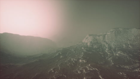 rocks and mountains in deep fog