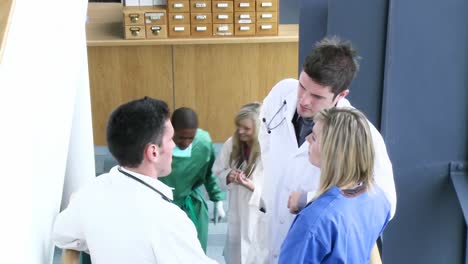 Doctors-shaking-hands-on-the-stairs-of-a-hospital-