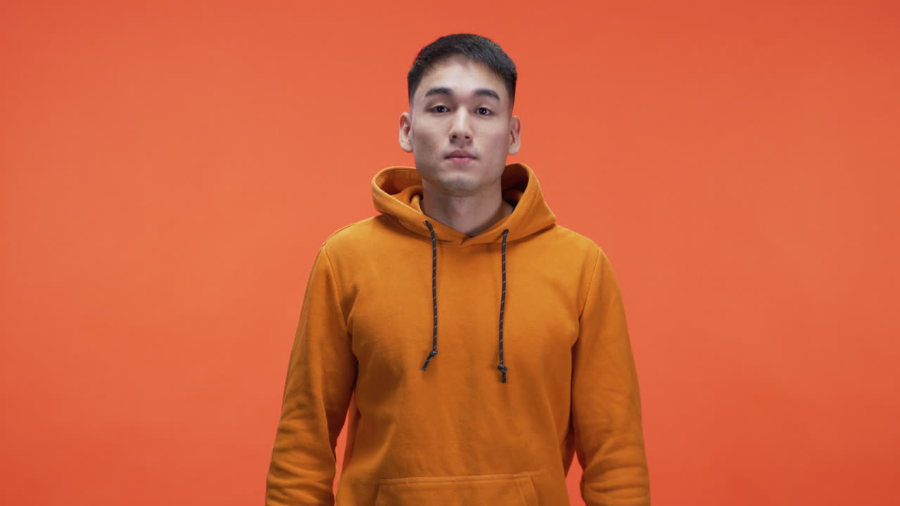 Man in Orange Hoodie