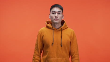man in orange hoodie