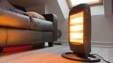 halogen portable electric indoor heater heating rotating to warm up a cold room in the winter