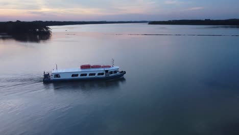 river-boat-sunset-beautiful-colorful-mirrored-drone