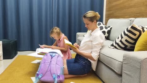 mother and daughter doing homework together