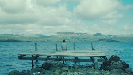 scenic timelapse young man enjoying view within nature on dock