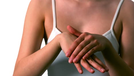 Woman-rubbing-moisturiser-on-her-hands