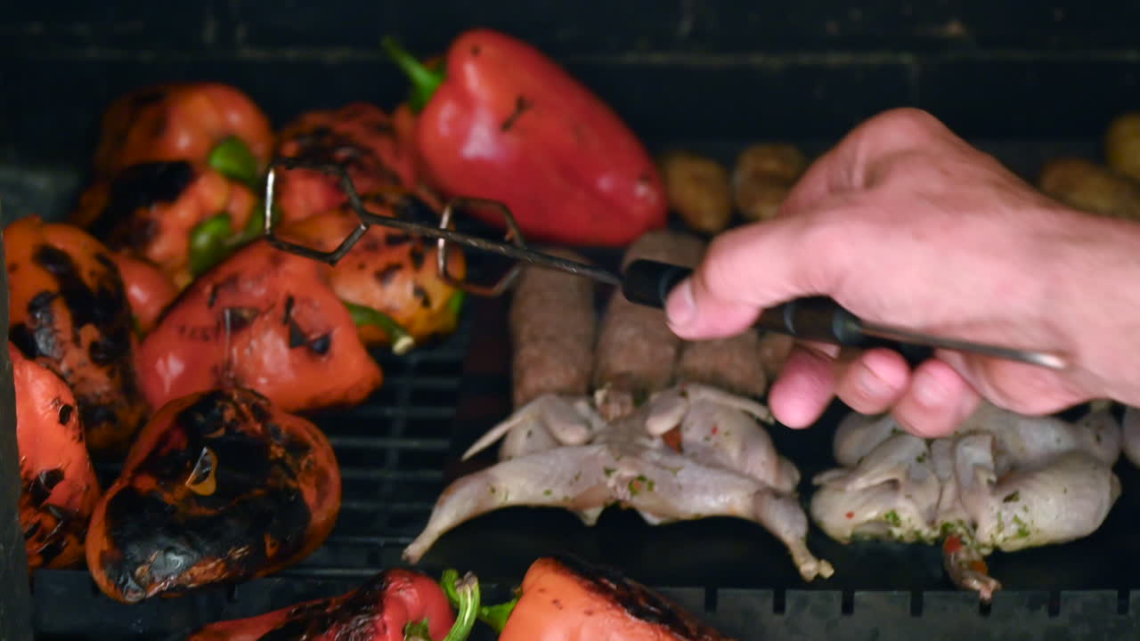 Bbq beef and quail meat on grill with vegetables