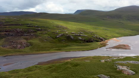 revealing drone shot of sanwood bay beach, a natural bay in sutherland, scotland