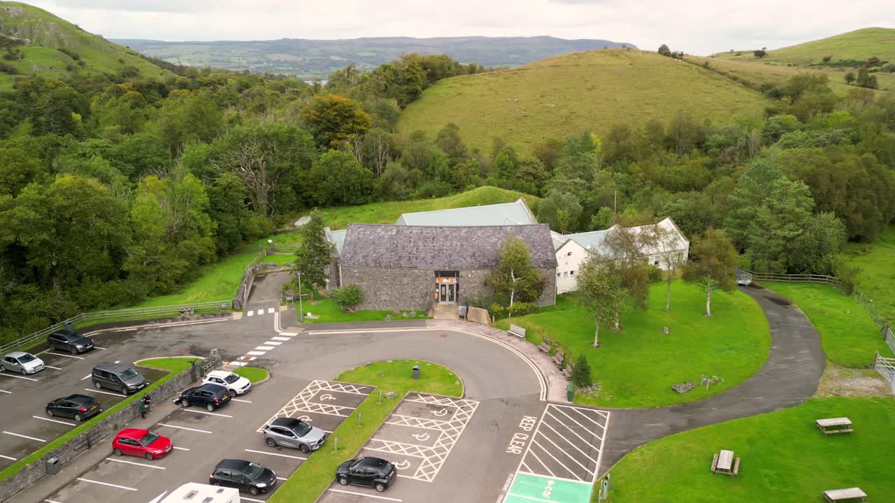 Rising 4K 30FPS aerial of Marble Arch Caves in County Fermanagh, Northern Ireland on a bright sunny day. Produced with Rec709 color
