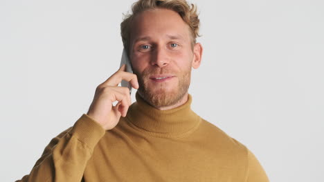 Happy-guy-having-a-conversation-on-phone