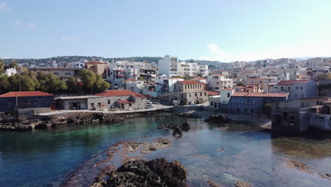 the-sea-with-rocks-and-the-city-in-the-background