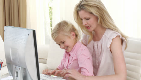 mother and daughter using a computer