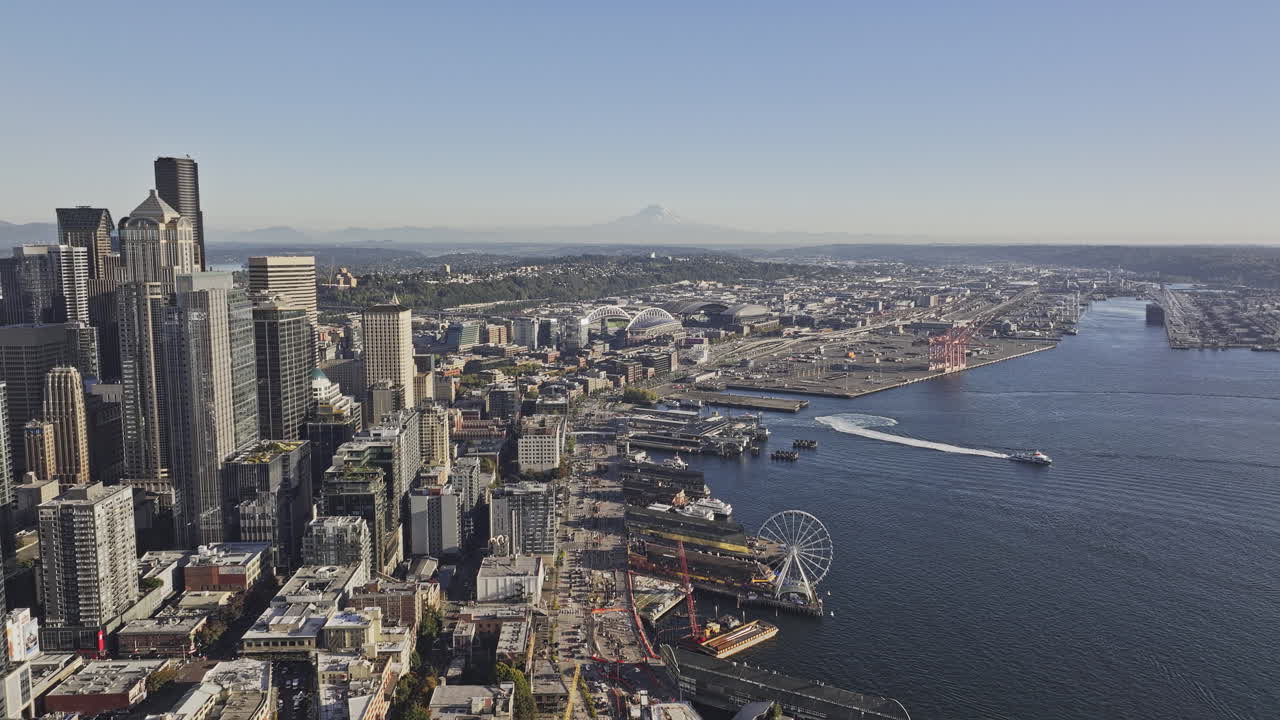 Seattle Washington Aerial v156 reverse flyover waterfront piers capturing views of SoDo industrial area, downtown cityscape and Mount Rainier on a clear day - Shot with Mavic 3 Pro Cine - Oct 6th 2023