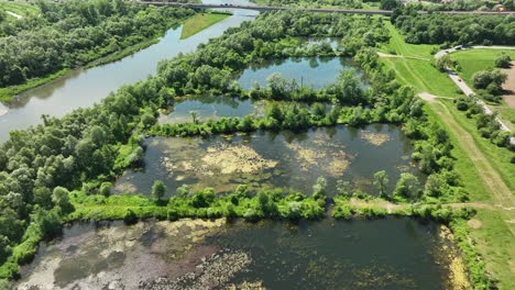 artificial ponds, freshwater reservoir by the river, wetland ecosystem aerial