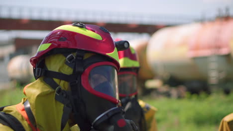 firefighters in protective gear at industrial site