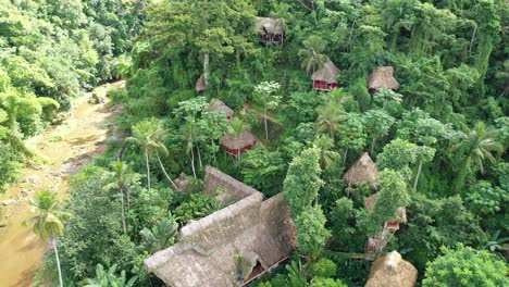 aerial top-down backward over el valle tree house village, samana