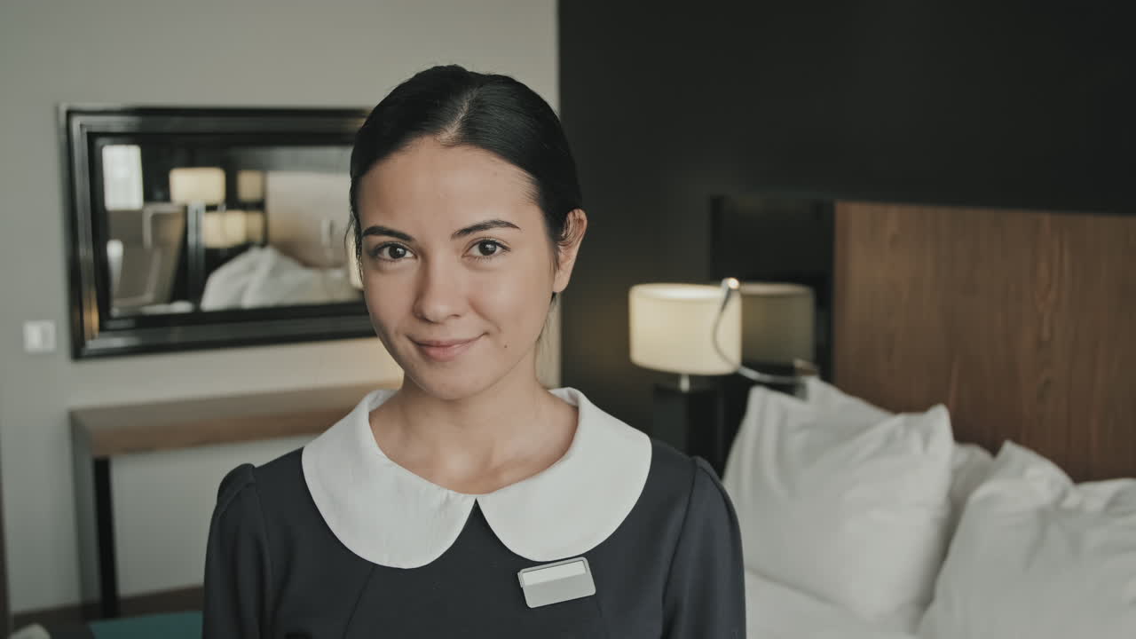 Female Housekeeper at Work in Hotel
