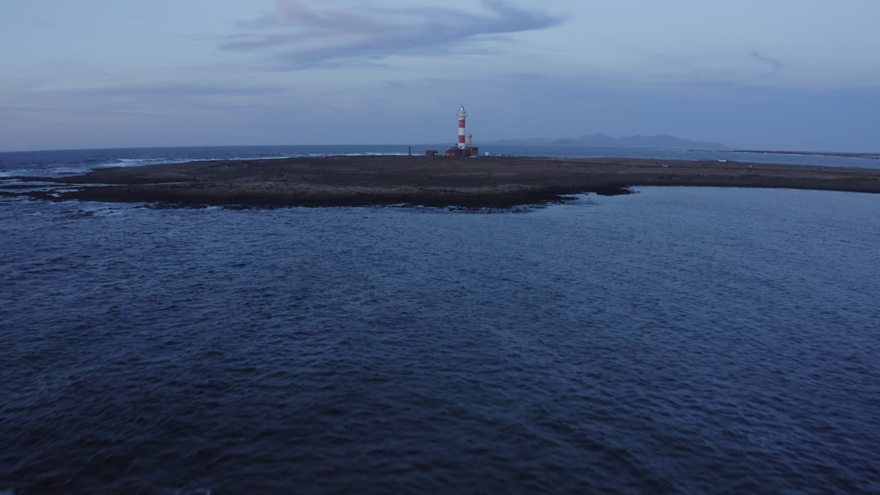 Lighthouse on a Volcanic Island at Dusk