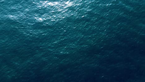 aerial shot beautiful smooth water surface of dark blue clear sea