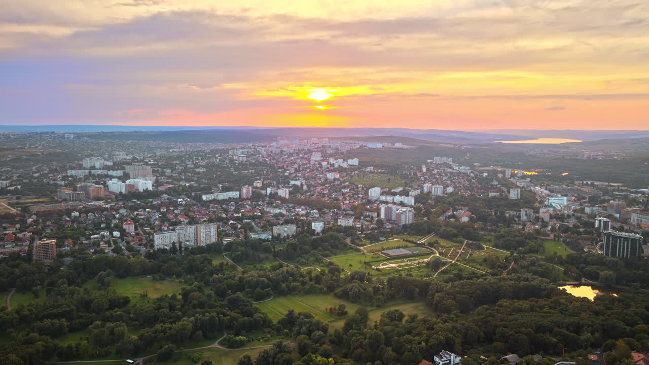 Aerial sunset drone view of Chisinau city with Dendrarium park. Moldova
