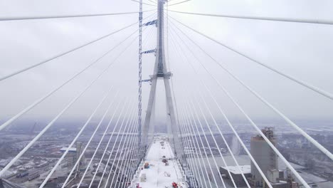 gordie howe bridge tower with loose cable lines in winter
