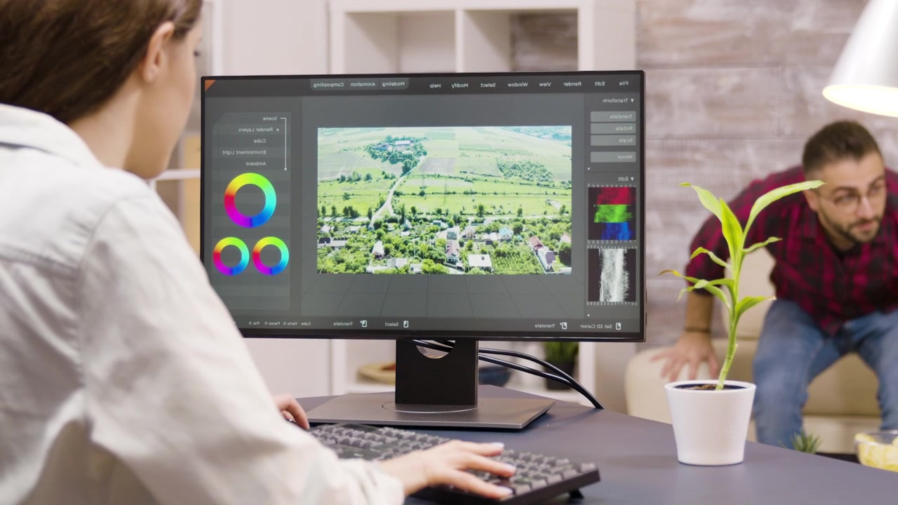 Graphic Designer Working on Landscape Photo Editing in Home Office