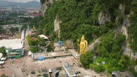 drone flight to murugan hindu deity statue in batu caves attraction in malaysia