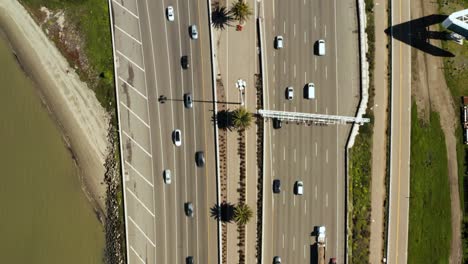 aerial top down view on i-80 freeway, oakland to san francisco with water each side